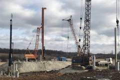 Unloading of reinforced concrete piles with an MKG-25br crane. Site: A transshipment terminal with the shipment of grain and oil crops to the river transport TOV (limited liability company) JV NIBULON. Ternivka village. Zaporizhia region Customer: TOV (limited liability company)JV NIBULON.
